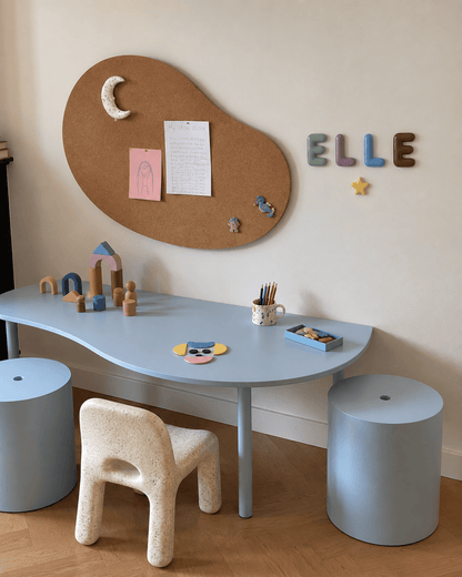 Handcrafted ceramic letters and symbols styled above a kids&